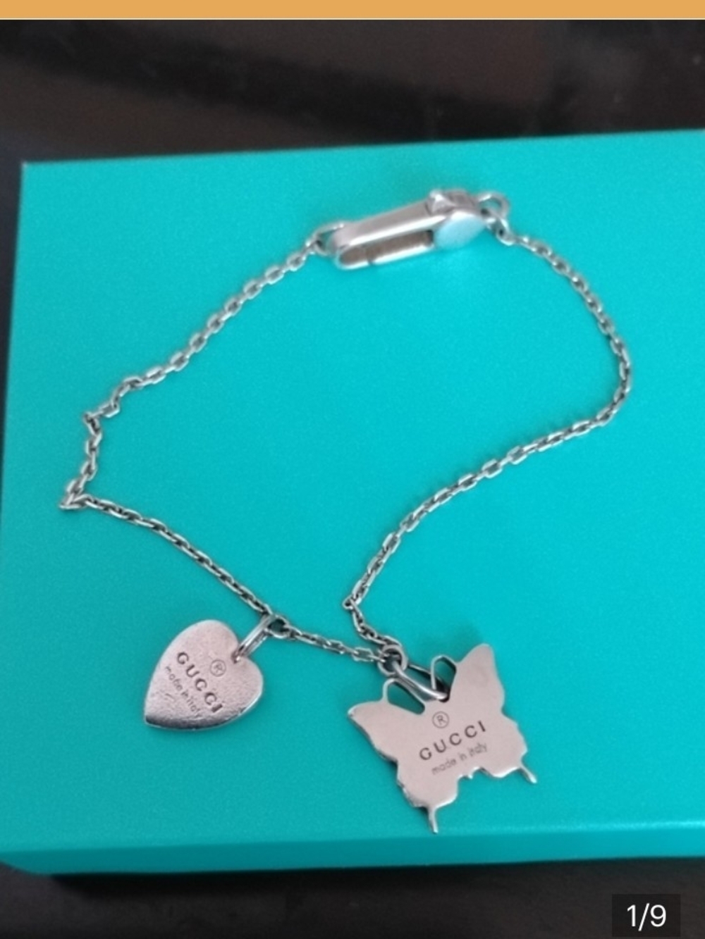 Gucci Silver Heart and Butterfly Charm Bracelet.